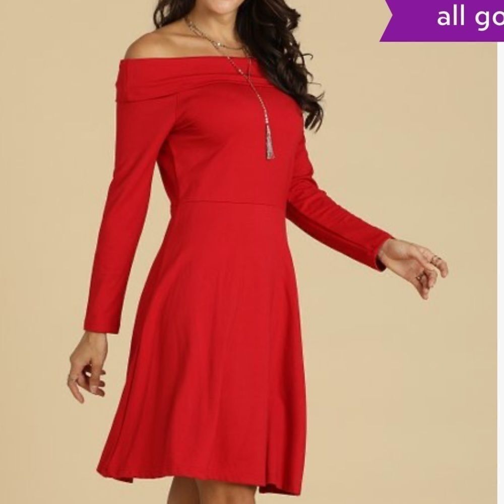 Suzanne Betro fit to flare red off shoulder dress.